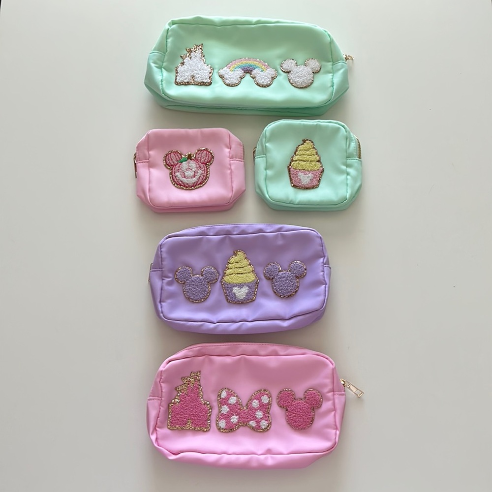 Main Street Couture Disney inspired pouches 1 med, 2 sm, 2 mini.